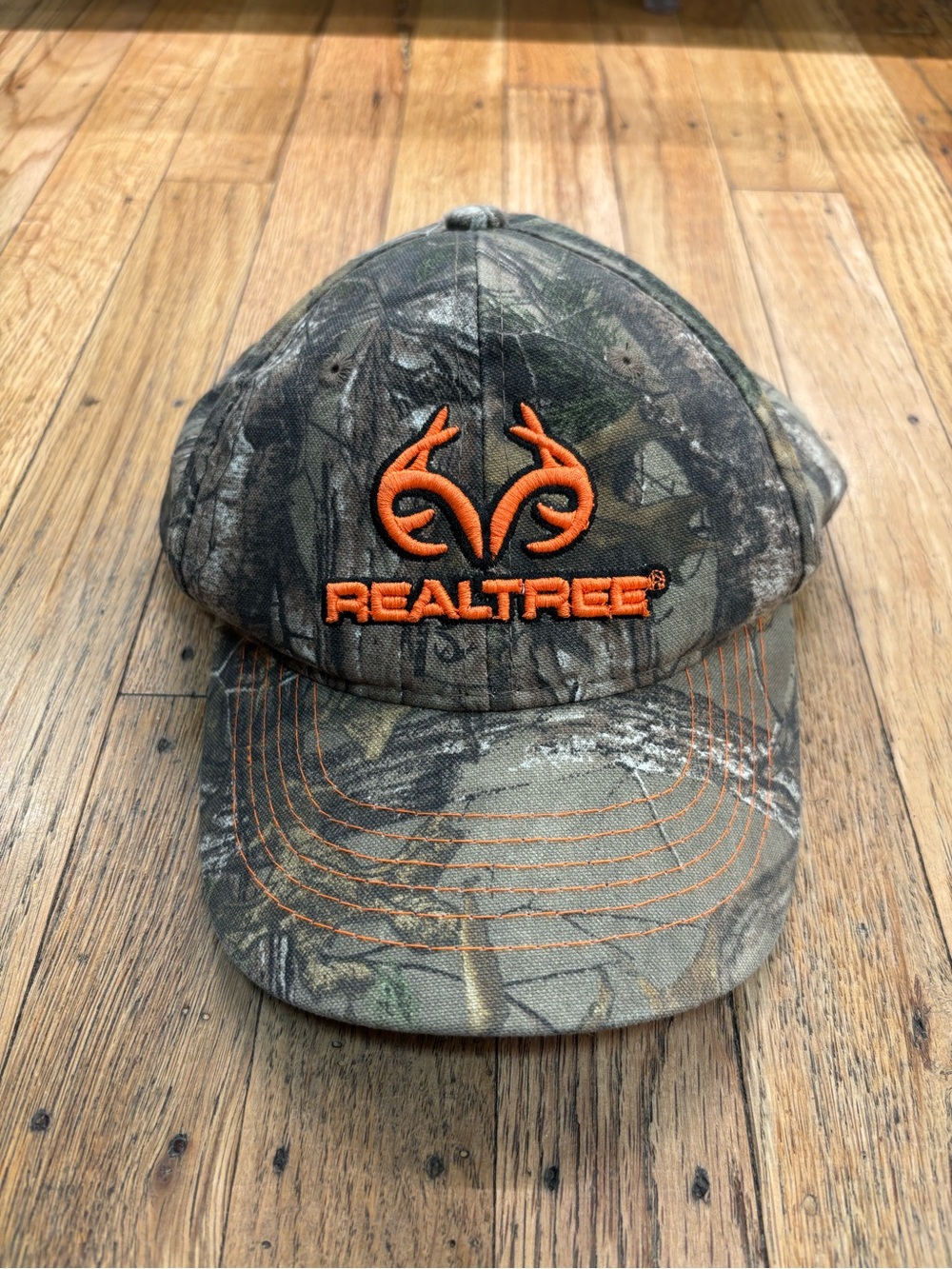 Realtree Camouflage Hat with Orange Logo